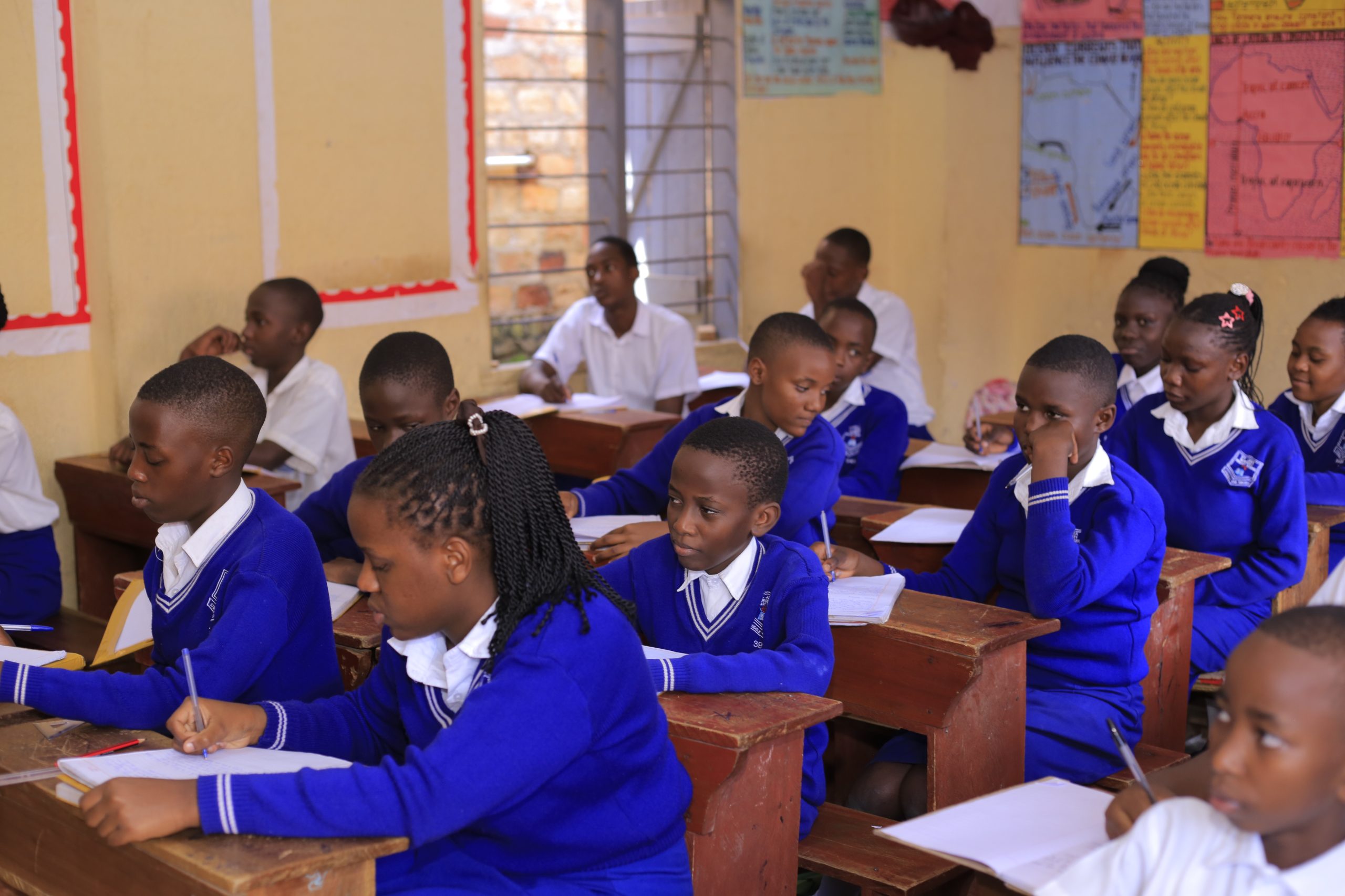Teacher guiding St Jude pupils in class